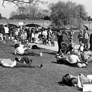 Visitors relaxing by the river Avon at Stratford-upon-Avon. 16th April 1974