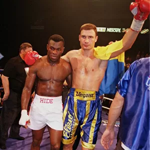 Vitali klitschko with arm around Herbie Hide after knocking him out in two rounds to take