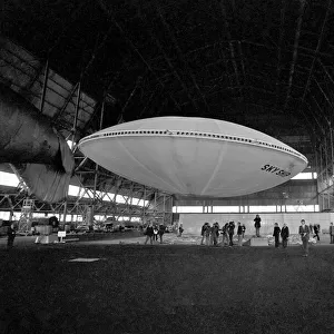 VVery quietly, the worlds first flying Saucer, or Skyship as its designers prefer to call