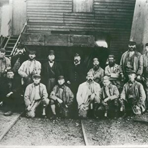 Waiting for the cage. Miners about to start their shift at Lambton Colliery. Circa 1920