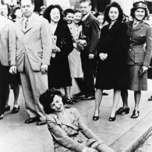 After waiting hours to buy nylons that went on sale post WW2 this young woman couldn