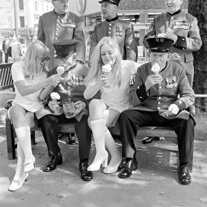 Waitress from the Chelsea Drugstore share a Ice Cream with some Chelsea pensioners to