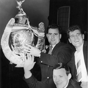 Wakefield Trinitys Captain D Turner, Albert Firth and Neil Fox hold the trophy aloft for
