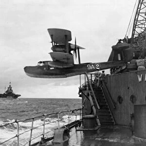 A Walrus aircraft of the British Royal Navy Fleet Air Arm ibeing catapulted from