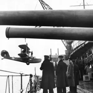 A Walrus aircraft returning from patrol is picked up and hoisted aboard battleship HMS A Walrus aircraft returning from patrol is picked up and hoisted aboard battleship HMS