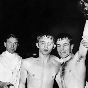 Walter McGowan boxer arm raised celebrates winning victory arm around opponent flyweight