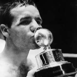 Walter McGowan kisses title trophy after win London 1966 beating Salvatore Burruni