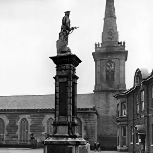 The war memorial and parish church, Prescot, Knowsley, Merseyside. February 1958
