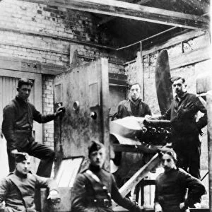 Warrant Officer Tom Guttery (centre) seen here in the test house of his workshop at an