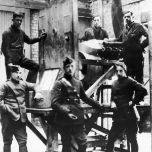 Warrant Officer Tom Guttery (centre) seen here in the test house of his workshop at an