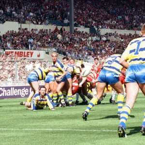 Warrington desperately clear their lines from deep within their own half during the Rugby Warrington desperately clear their lines from deep within their own half during the Rugby