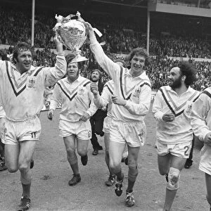 Warrington RLC seen here celebrating winning the Rugby League Cup by completing a victory