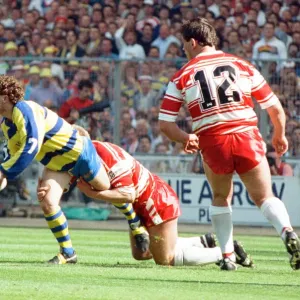 Warringtons Paul Bishop gets the ball away just as the Wigan defence close him down Warringtons Paul Bishop gets the ball away just as the Wigan defence close him down
