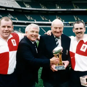 Warwickshire match secretary Harry Walker celebrates with the CIS Insurance Country