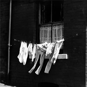 A washing line near a terrace house in Manchester Circa 1960