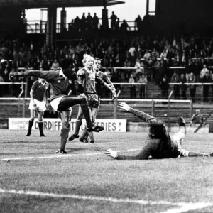 ) watches as Dave Bennett scores against Hereford goalkeeper John Jackson. Aug 1982 ) watches as Dave Bennett scores against Hereford goalkeeper John Jackson. Aug 1982