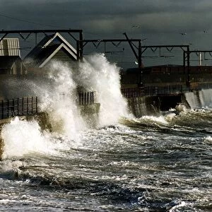 Waves crash against a wall at Solcots after heavy winds caused the sea to become rough