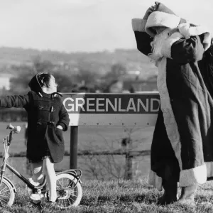 That way, Santa, says toddler Laura Tyrell, aged 4, to Father Christmas after he got That way, Santa, says toddler Laura Tyrell, aged 4, to Father Christmas after he got