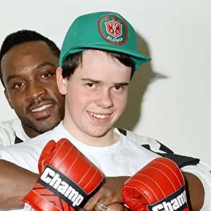 Former WBO middleweight champion Nigel Benn with boxer Richard Ross. 6th March 1990