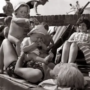 Weather - Hot Sunny Sunbathing Children Playing in the Sun - 2 babies sitting Weather - Hot Sunny Sunbathing Children Playing in the Sun - 2 babies sitting