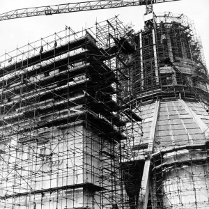 In a web of steel scaffolding, the main entrance to the Liverpool Metropolitan Cathedral In a web of steel scaffolding, the main entrance to the Liverpool Metropolitan Cathedral