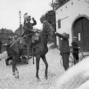 A welcome drink for a thirsty French Dragoon Scout in Belgium reconnoitering near