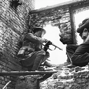 Welsh Guards in a ruined building during a training exercise. 26th February 1940