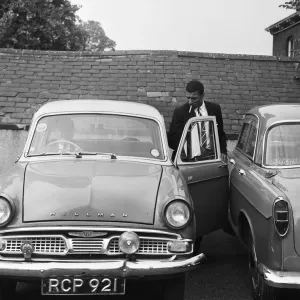 Black and white print of a man leaving the Rugby league headquarters Black and white print of a man leaving the Rugby league headquarters