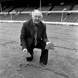 Wembley groundsman Don Gallacher inspects the damage cause by the Scottish fans following