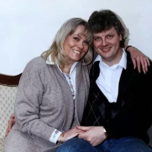 Wendy Richard & husband April 1989 sitting on a sofa, posing for the camera