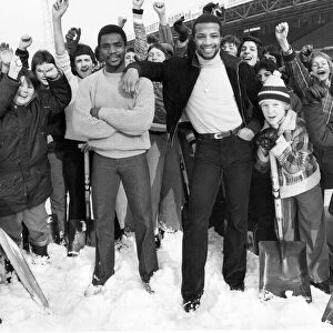 West Bromwich Albion footballers Laurie Cunningham and Cyrille Regis with West Brom fans
