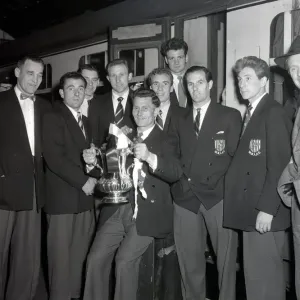 West Bromwich Albion Players with the FA Cup trophy prior to boarding the train as they