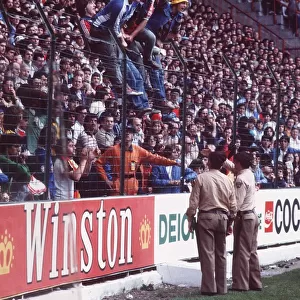 West Germany v Chile fans World Cup 1982 football supporters standing on fence police