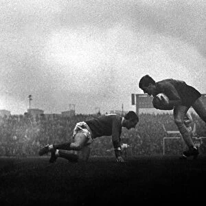 West Ham goalkeeper Jim Standen gathers a low cross as David Herd of Manchester United
