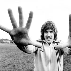 West Ham goalkeeper Phil Parkes shows his large hands to the camera