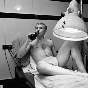 West Ham United captain Bobby Moore spending a few quiet minutes under the sun lamp with