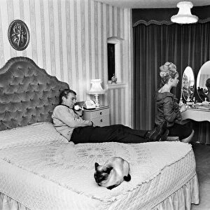 West Ham United and England footballer Bobby Moore pictured at home with his wife Tina