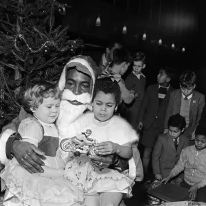 West Indians give a party for white and black children. Children get together in