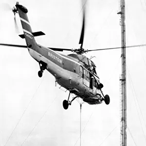 A Westland Wessex helicopter, operated by Bristow, tackles the job of airlifting the tip