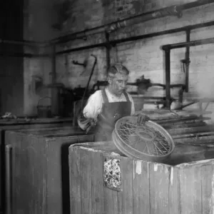 Wheels being dipped in chemicals in preparation for their tyres for the production line Wheels being dipped in chemicals in preparation for their tyres for the production line