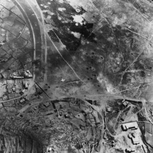 The white signal of surrender on the bomb battered landing ground on the island of
