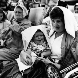 Who cares about the rain-when theres a towel and a pram apron about Who cares about the rain-when theres a towel and a pram apron about