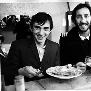 The Who pop guitarist Pete Townshend eating 1978 lunch with British actor Phil