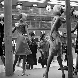 Whos the dummy? Window shopping in Oxford Street, London. Circa 1960