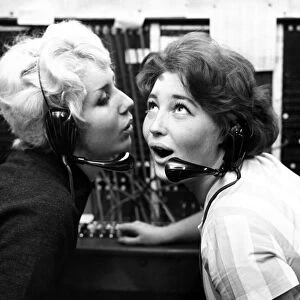 Wicked whispers, September 1960 Girls gossiping in the office Wearing