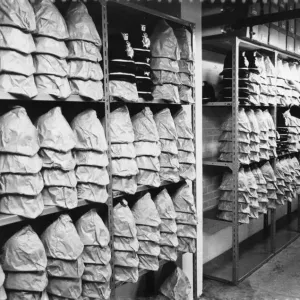 A wide selection of different sized helmets at the Mid Anglia police Headquarters, 1973