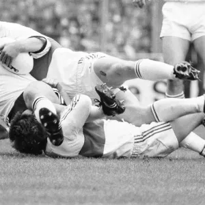 A Widnes player is brought down by a high tackle during the Rugby League Cup Final A Widnes player is brought down by a high tackle during the Rugby League Cup Final