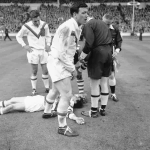 Wigan full back Bolton lies on the ground concussed after the half time whistle had blown Wigan full back Bolton lies on the ground concussed after the half time whistle had blown