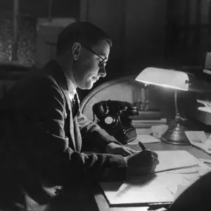 A photograph of William Connor at his desk in Geraldine House A photograph of William Connor at his desk in Geraldine House