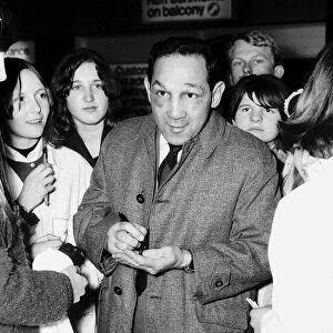 Willie Pep former world featherweight boxing champion signing autographs at Heathrow